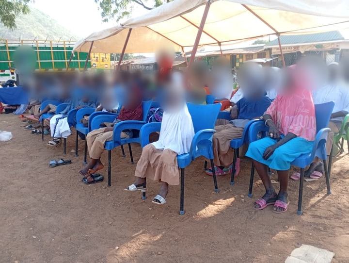 Students and families at a community gathering, March 2026. Faces blurred for privacy.